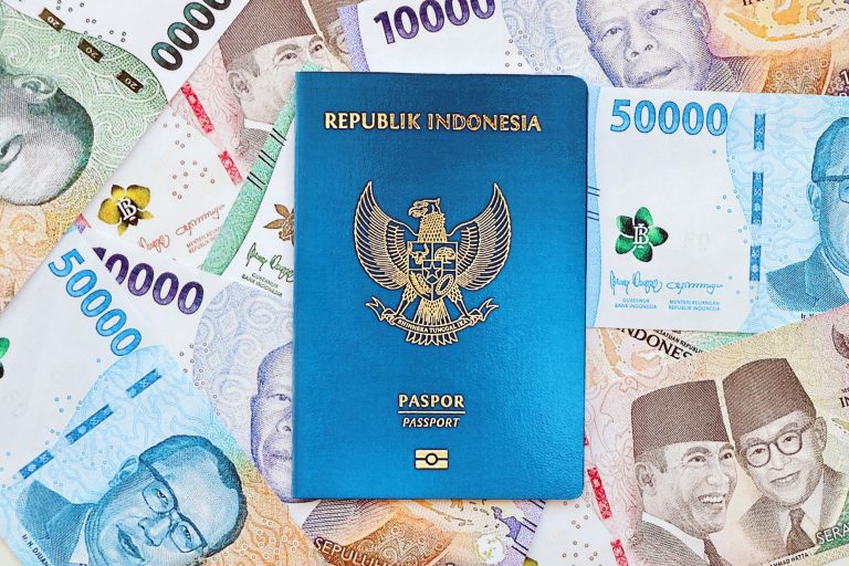 Indonesia passport and many indonesian rupiah currency money bills